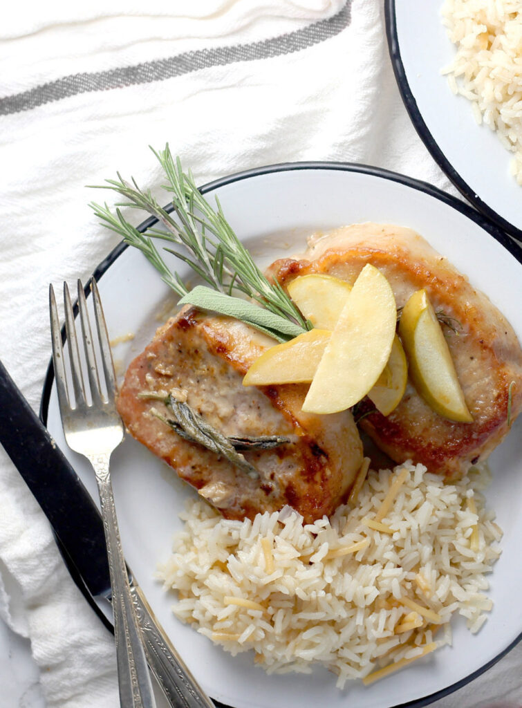 Lightly breaded pork chops are served with sauteed apples and onions and finished with the tastiest sage cream sauce. Get the full dang tasty recipe!