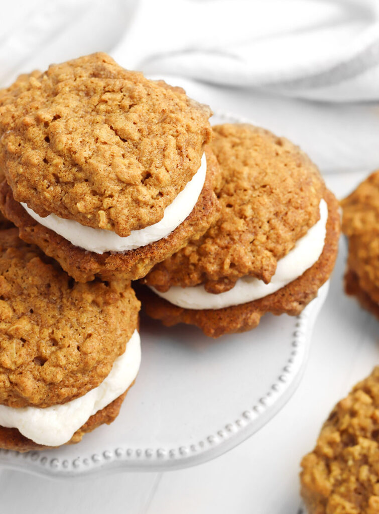 Love oatmeal cream pies? These sweetly stuffed cookie sandwiches add pumpkin and pumpkin spice for a delightful twist on the popular classic!